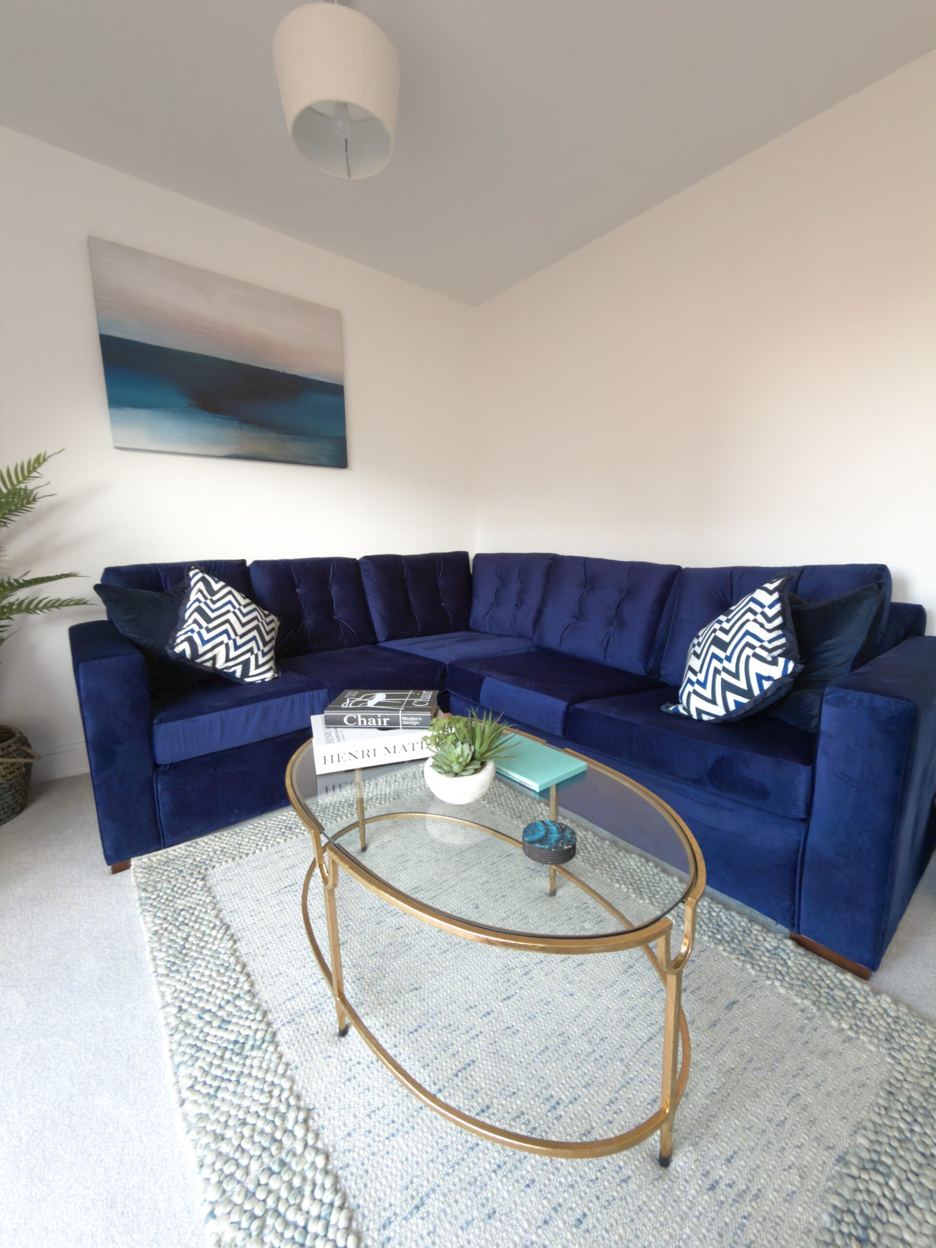 Living Room # (5) Modern living room with blue sofas and stylish decor.